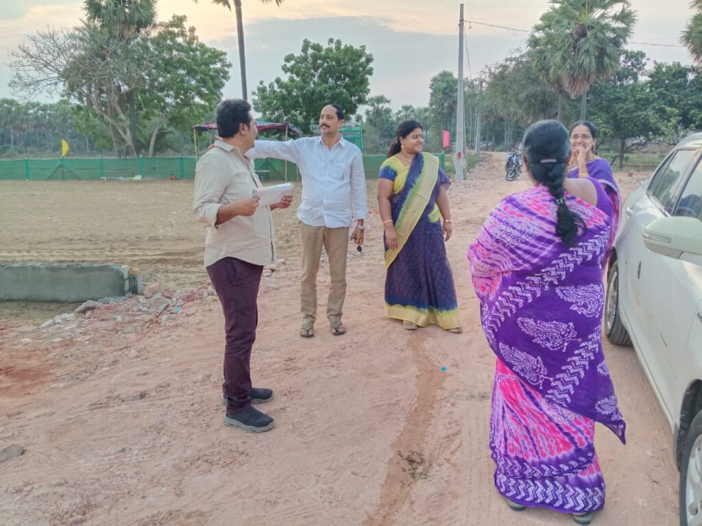 Customers visiting Ankuraa Developers' green plot site in Machilipatnam for inspection and discussion.